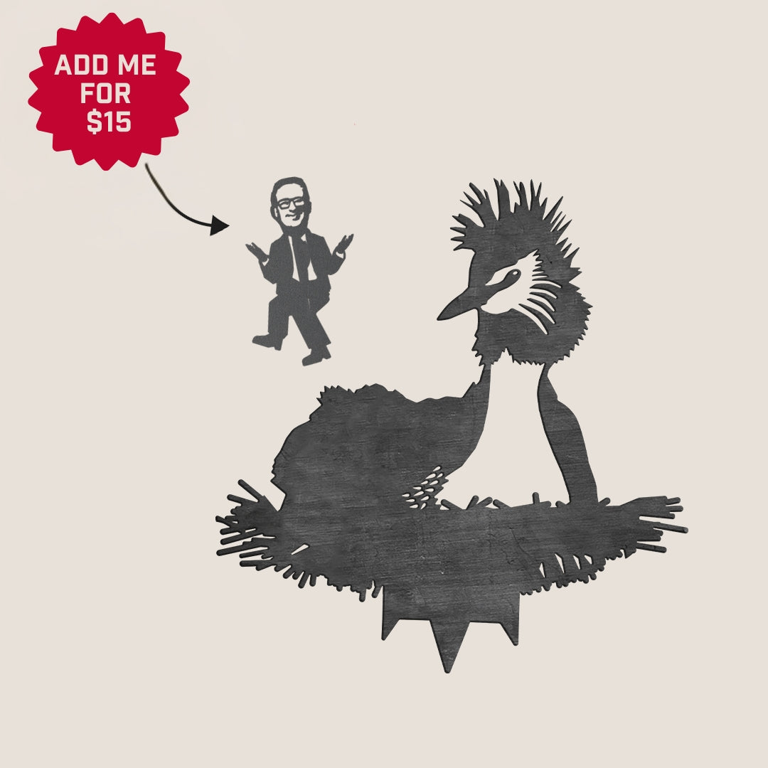A black metal silhouette of a Pūteketeke (Crested Grebe) by Metalbird New Zealand, with a cartoon person in a suit and glasses nearby. A red “ADD ME FOR $15” label points to the figure—premium yard art or a unique gift.