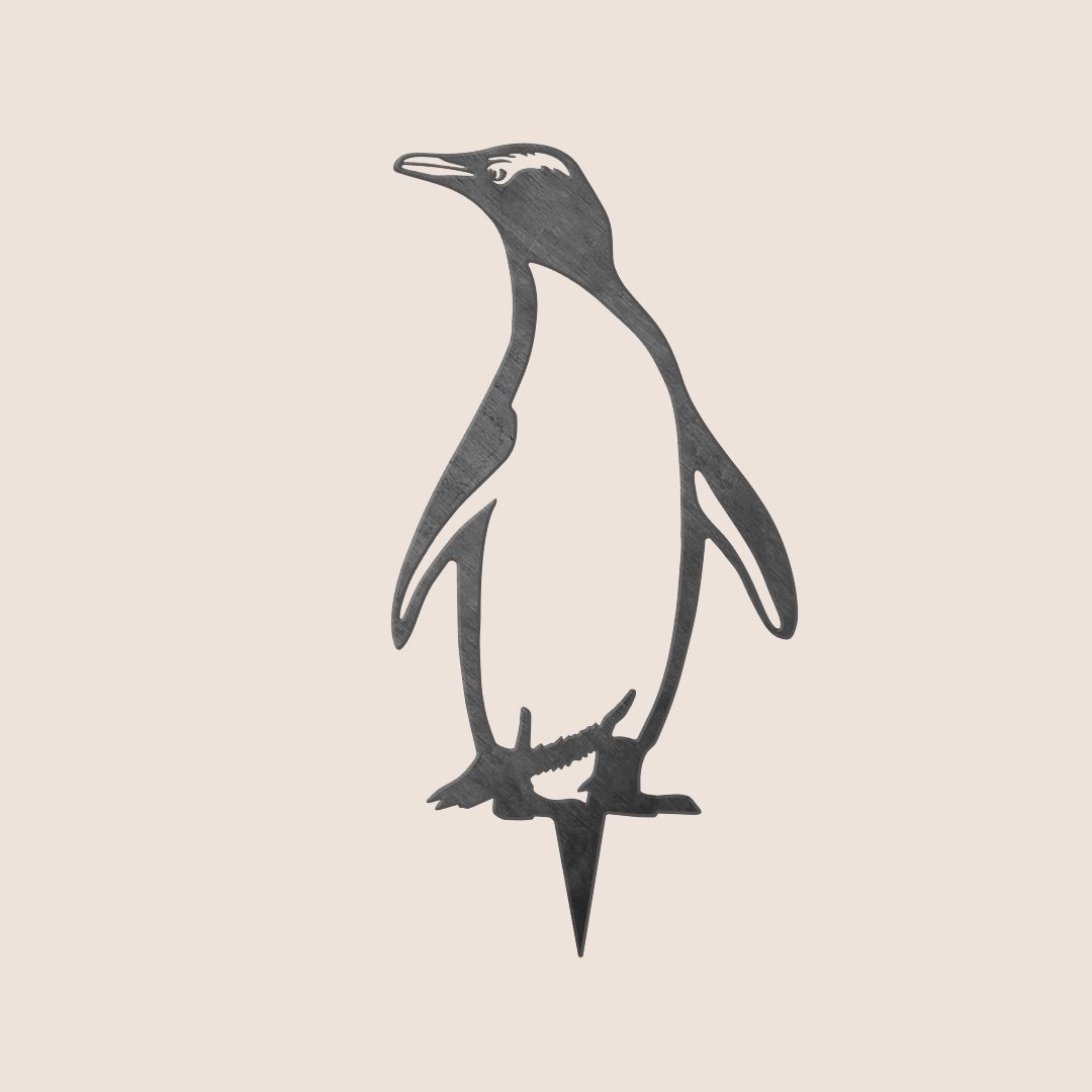The Metalbird New Zealand Hoiho / Yellow-eyed Penguin is a corten steel silhouette with a pointed stake, shown standing against a plain light background.