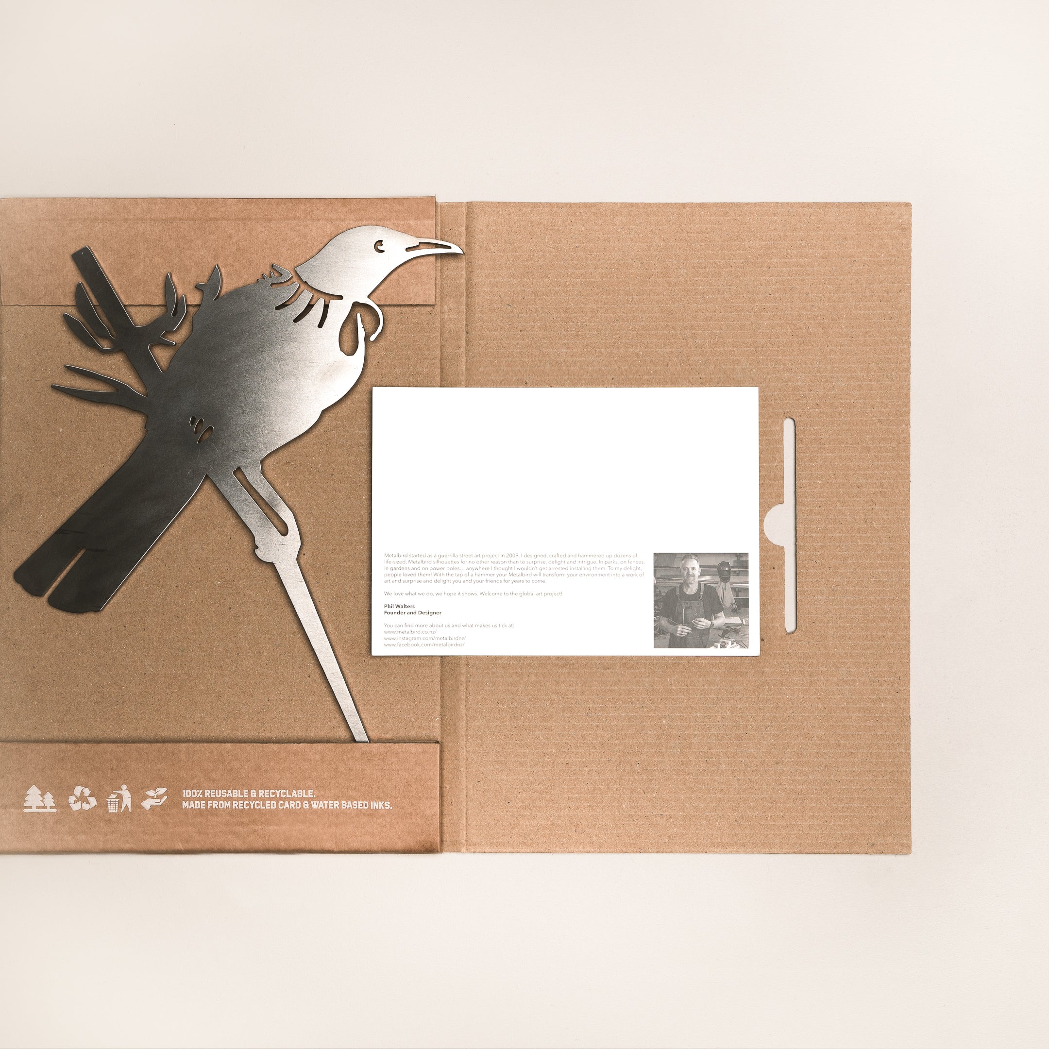 Tui bird silhouette in Corten steel with a customizable card, packed in a recycled flat-pack box for gifting in New Zealand.