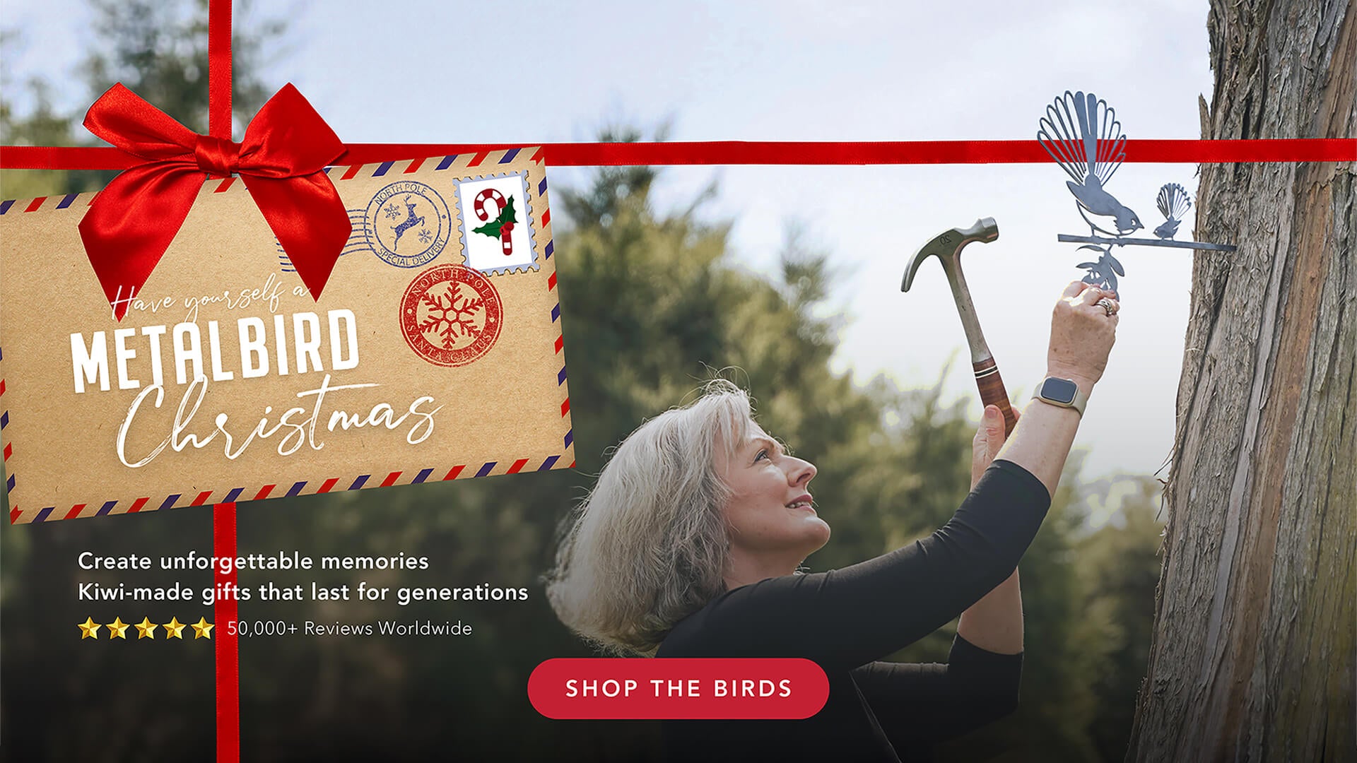 Advertisement for Metalbird Christmas gifts with a person holding a hammer and bird silhouette, featuring a red bow and promotional text.