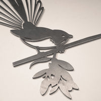 The Pīwakawaka Mum & Mini Set by Metalbird New Zealand features stylized metal wall art of a mother and baby fantail perched on a leafy branch—a unique NZ-inspired piece and a thoughtful Mother's Day gift.