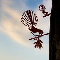 The Pīwakawaka Mum & Mini Set by Metalbird New Zealand features two metal silhouettes of native birds on branches—an ideal New Zealand-inspired Mother’s Day gift.