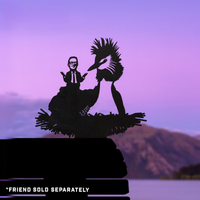 A businessperson’s silhouette sits on a Pūteketeke / Crested Grebe in its nest against mountains and a purple sky, echoing premium corten steel yard art by Metalbird New Zealand. The text in the corner reads “*FRIEND SOLD SEPARATELY.”.