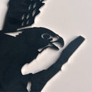 A close-up of Metalbird New Zealand's Kārearea: Wings of Glory silhouette, inspired by the NZ Falcon, Bird of the Year 2025, shows the detailed black metal cutout with outstretched wings on a white surface.