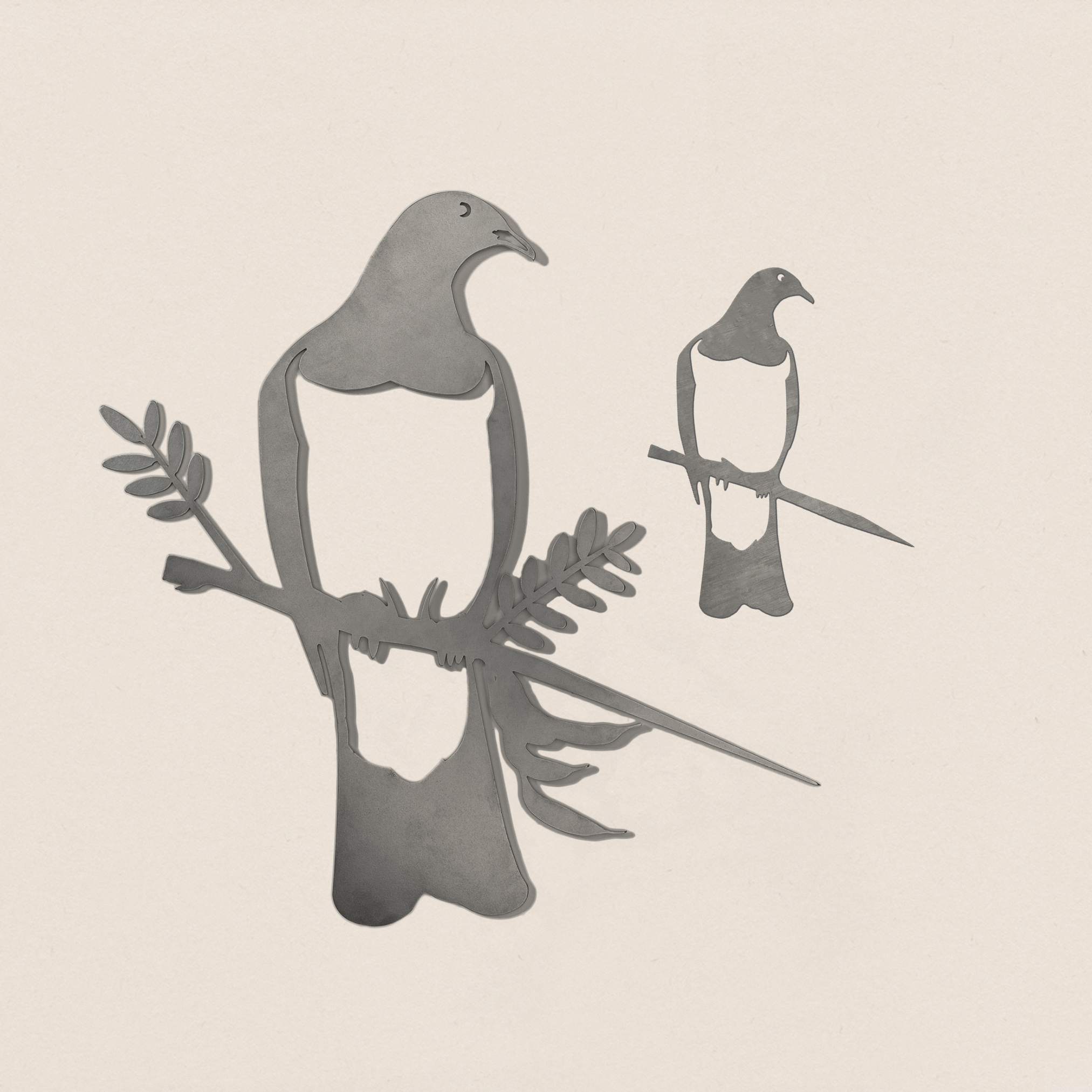 The Kererū Mum & Mini Set by Metalbird New Zealand features two abstract, grayscale Kererū birds—mum and baby—each with an olive branch, displayed on a light background. A perfect Mother's Day gift for bird lovers.