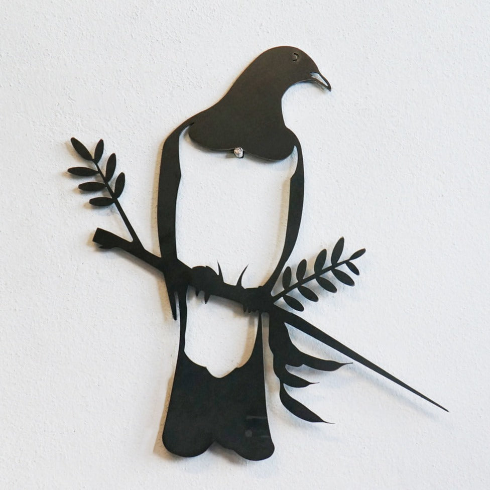 The Metalbird Seconds - PIWAKAWAKA AND BABY - XL by metalbird is a black metal wall art sculpture of birds on a branch. This discounted piece has minor imperfections, making each one unique and perfect for adding character to your decor.