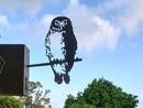 Ruru owl flying and morphing into Metalbird metal bird silhouette garden sculpture on fence post