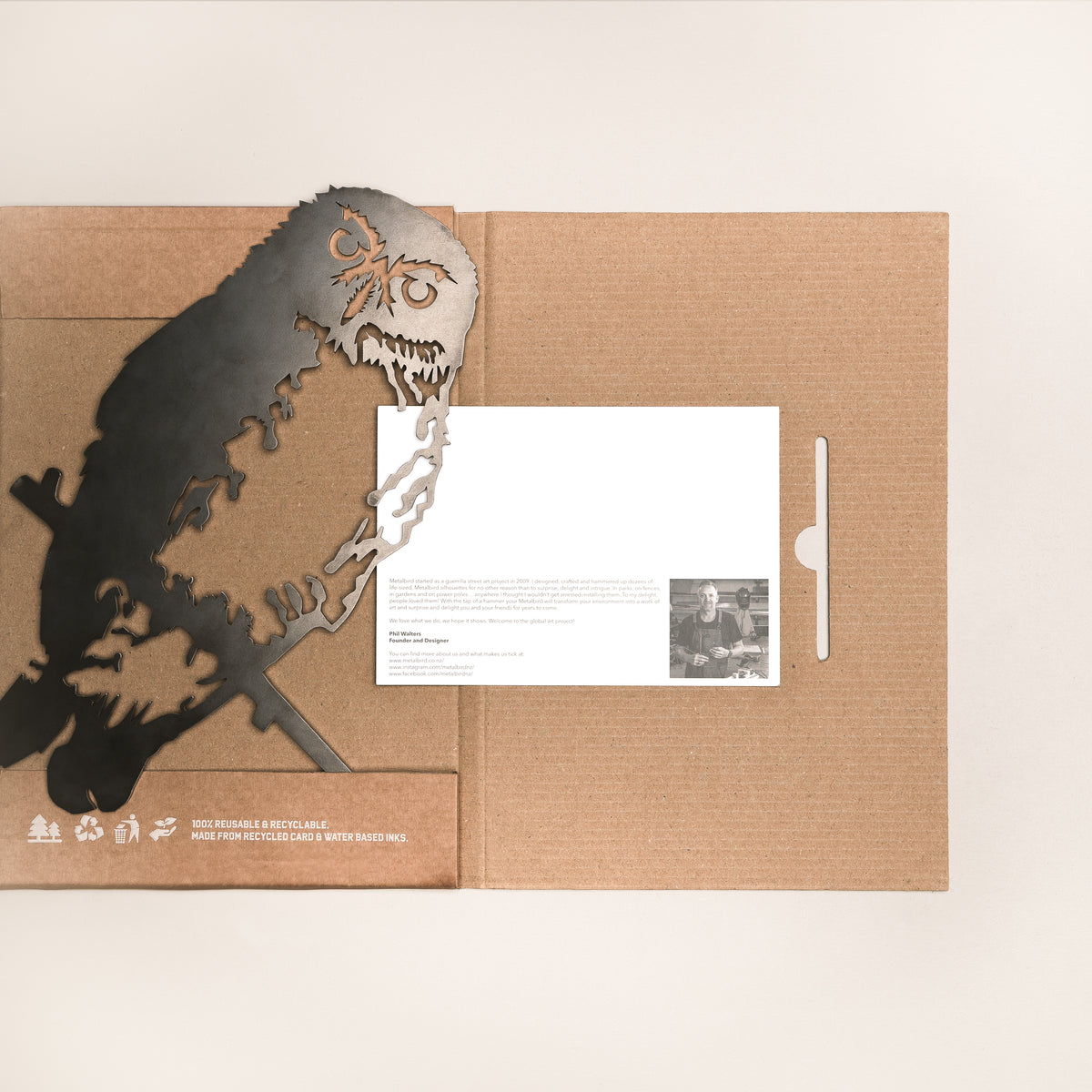 Ruru silhouette beside opened Metalbird packaging and printed card.