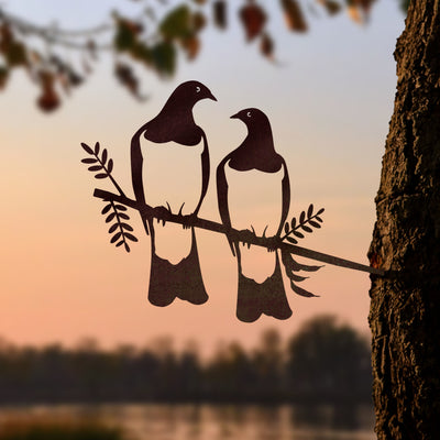 Kererū Pair by Metalbird New Zealand features two silhouetted birds perched on a leafy branch—an elegant metal art piece or thoughtful gift for nature lovers.