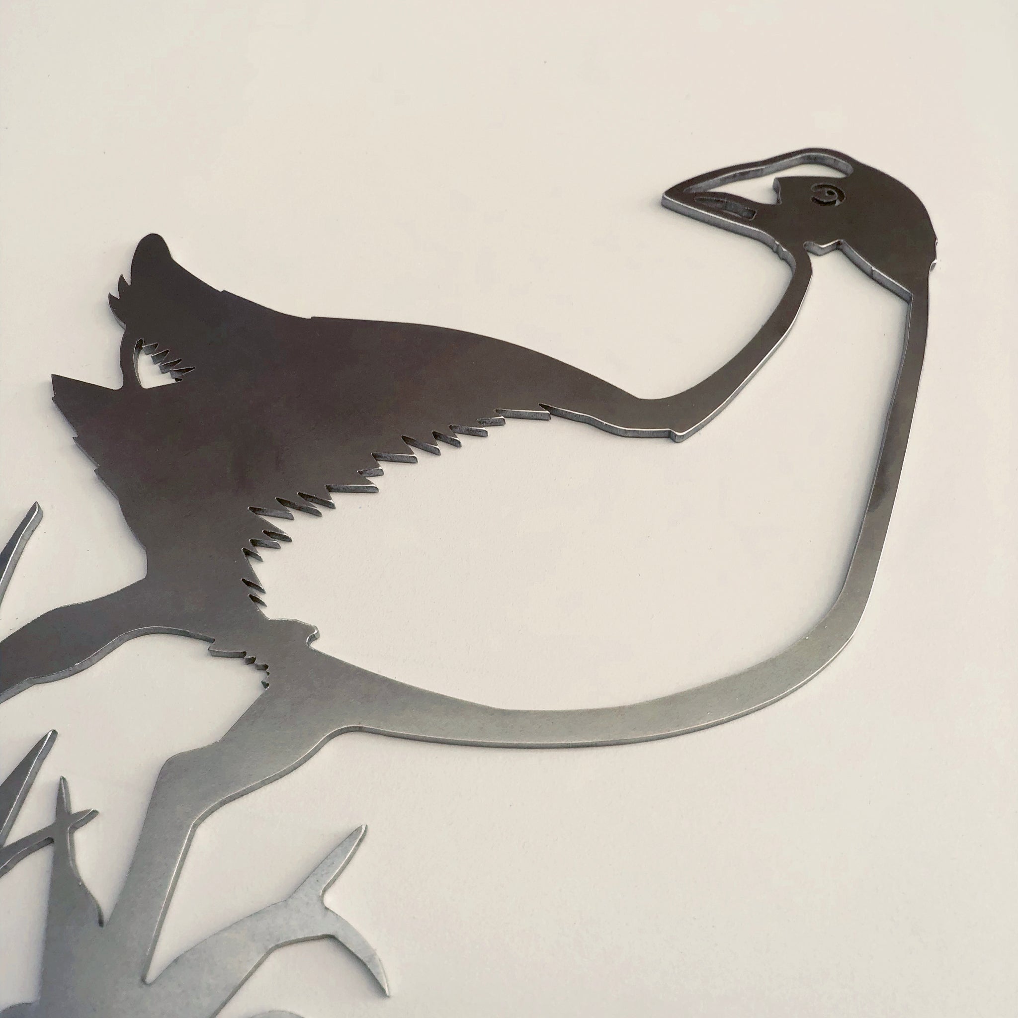 A corten steel cutout of a pūkeko by Metalbird New Zealand, shown in profile with a long neck and beak against a plain background—a distinctive kiwiana gift.