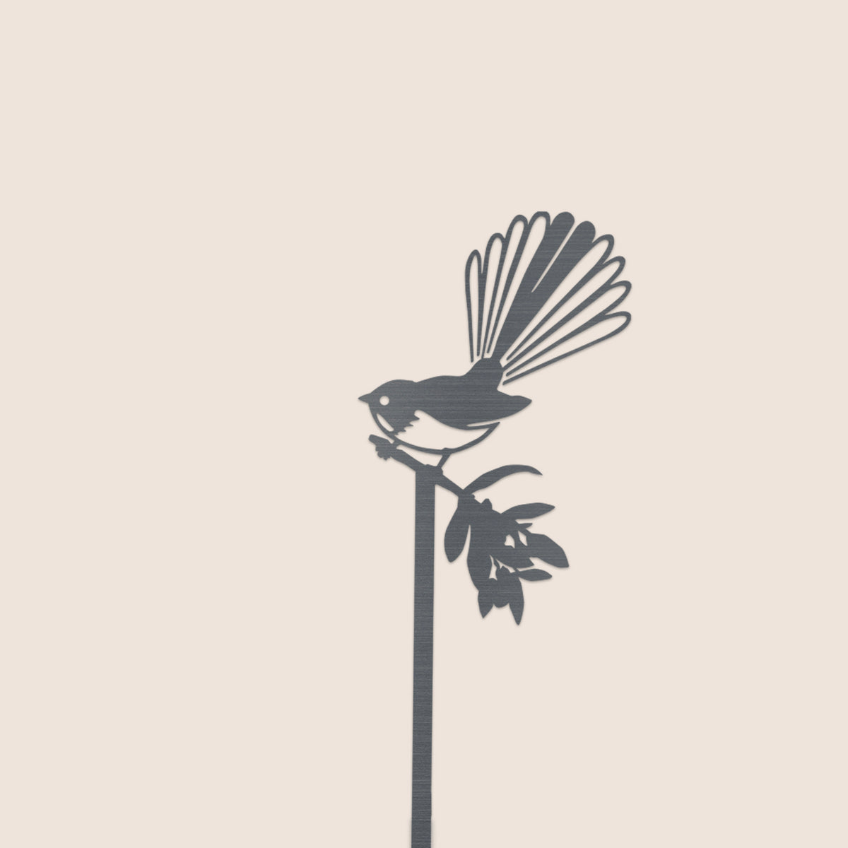The Pīwakawaka Plant Stake (70cm) by Metalbird New Zealand features a sleek bird with a fanned tail perched on a branch—an elegant gift or decorative accent for your garden or home.